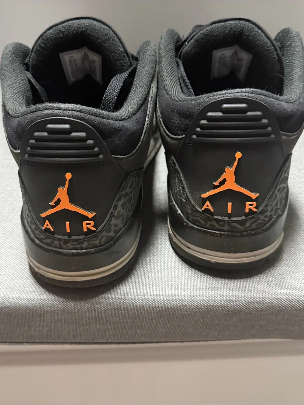 Retro 3 Jordan Men’s Black Sneakers with Orange Jumpman Accents